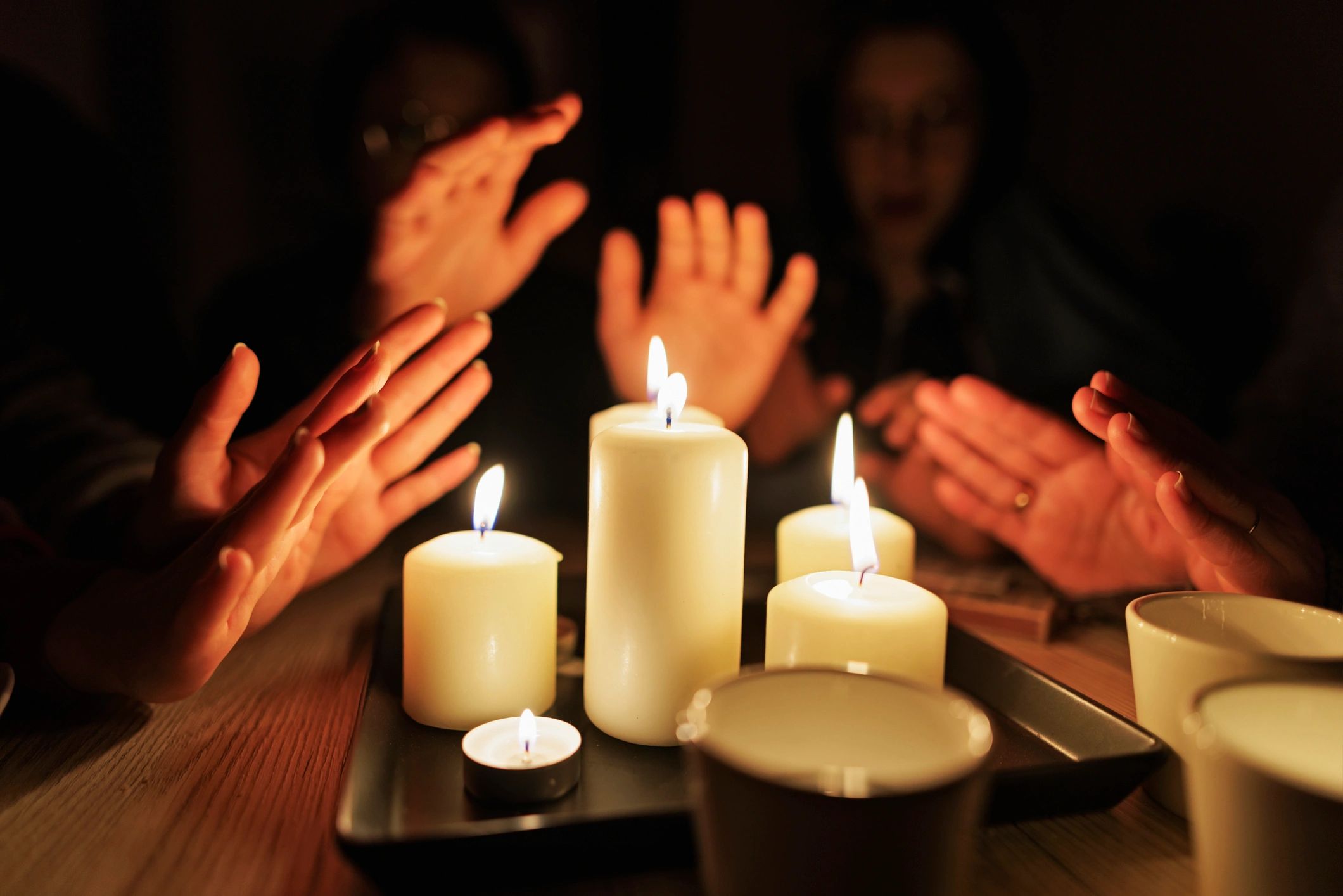 Family sitting by candlelight during blackout