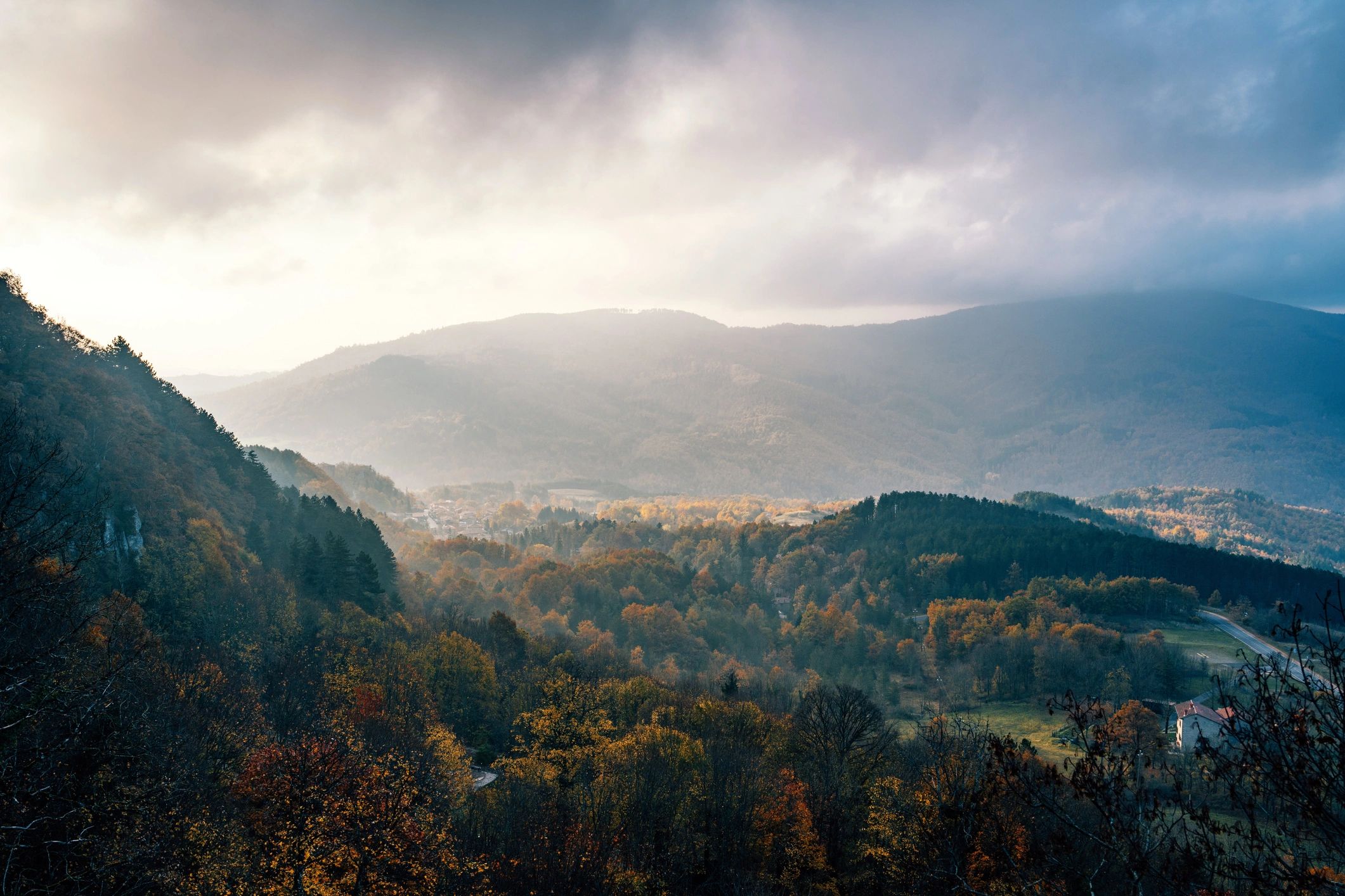 Autumn valley illuminated by sunrise